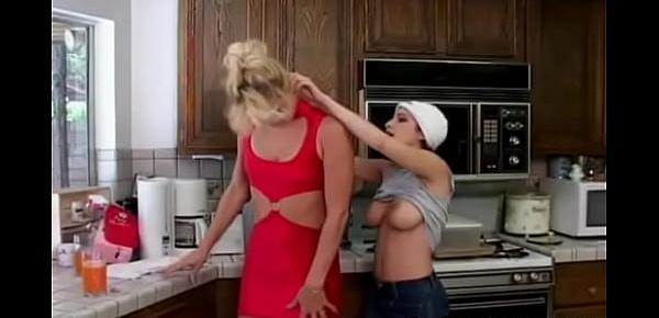  Lesbian dildo fucking in the kitchen